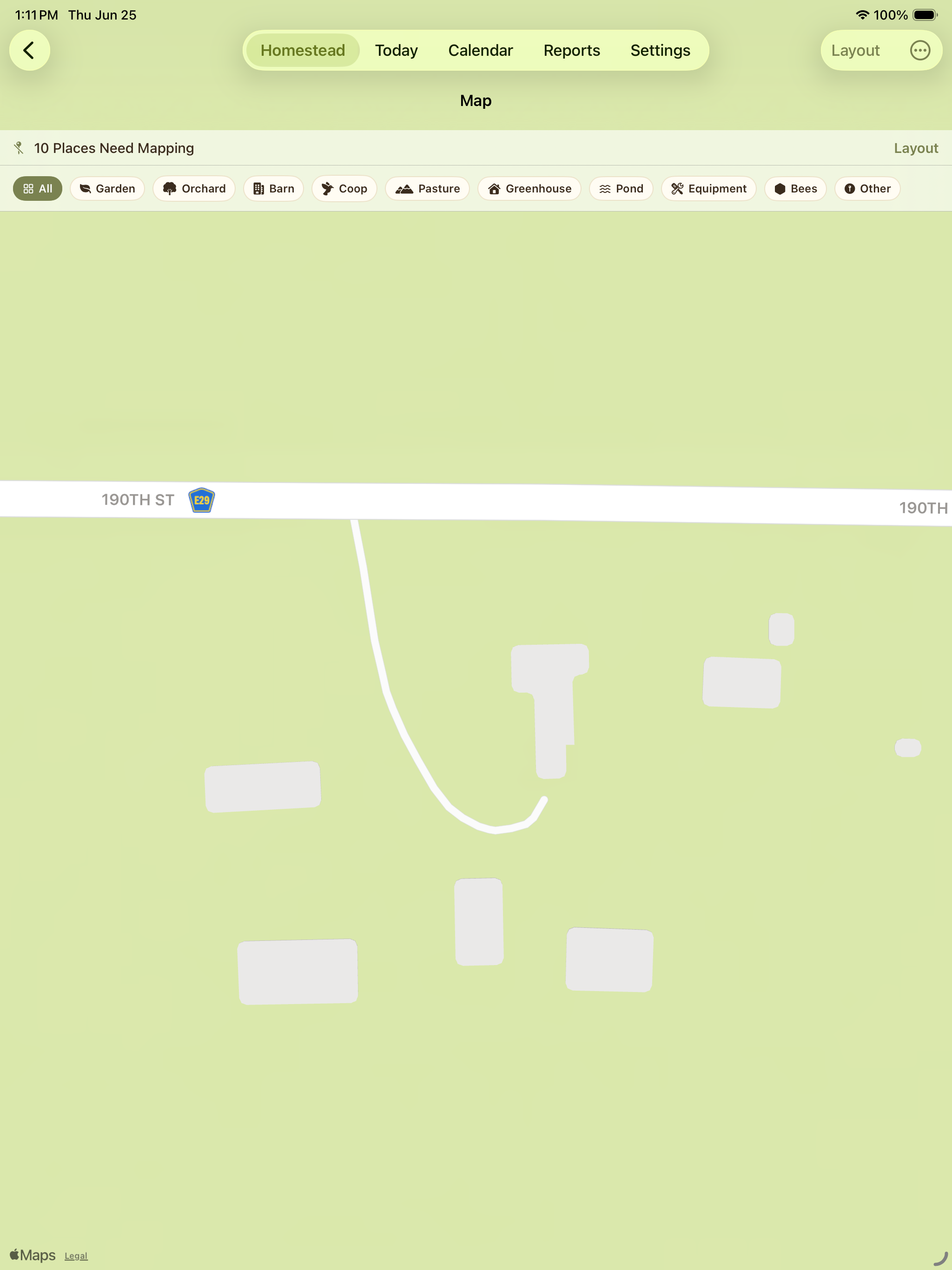 Map view showing a simple property map with roads and structures.
